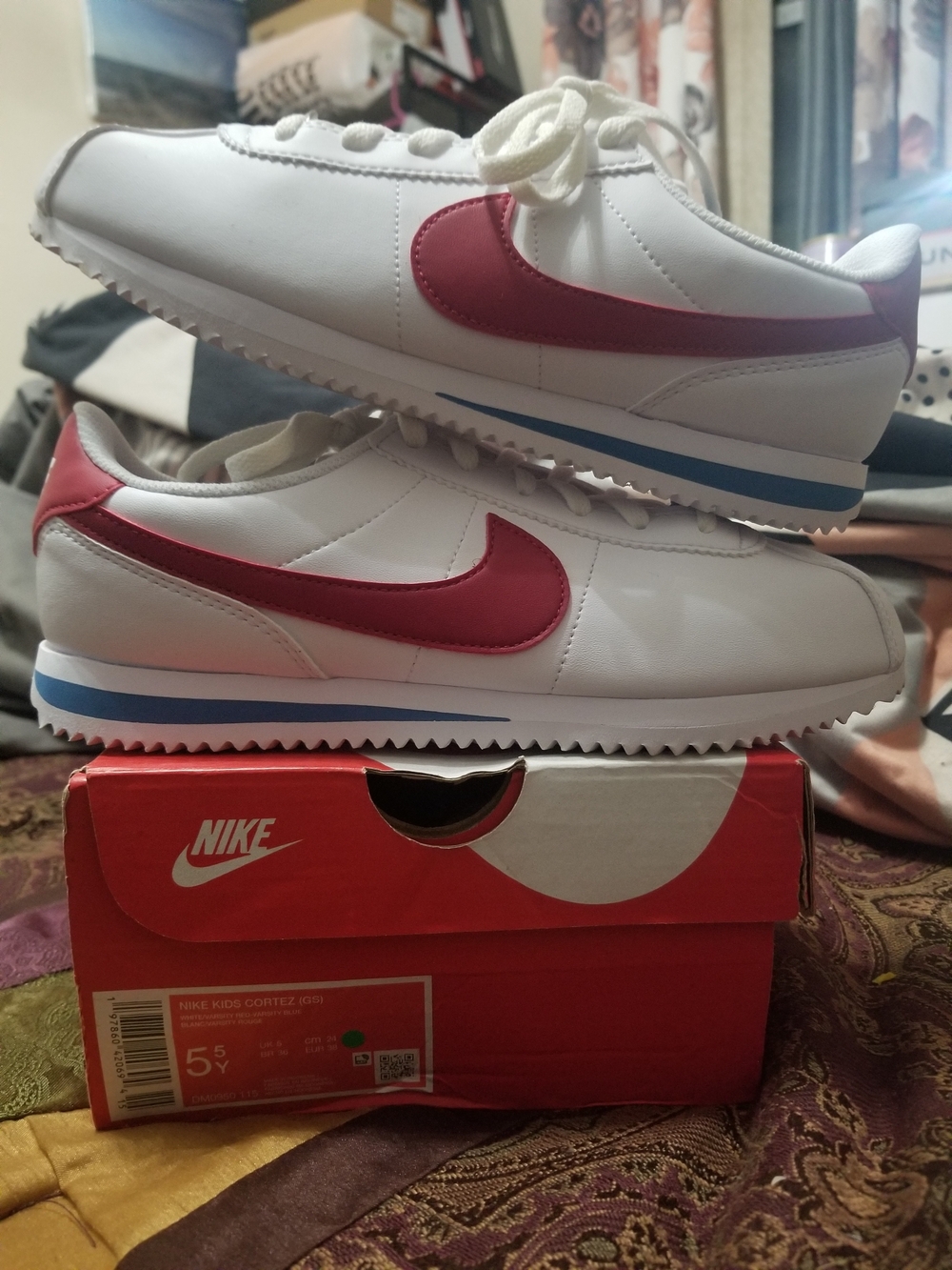 Nike White Sneakers with Red Swoosh and Blue Midsole Stripe